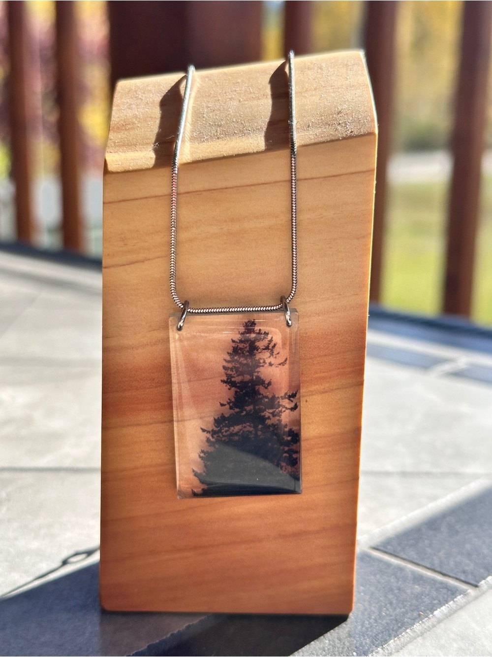 Silver-tone Clear Resin Artisan Pendant Necklace with Black Tree